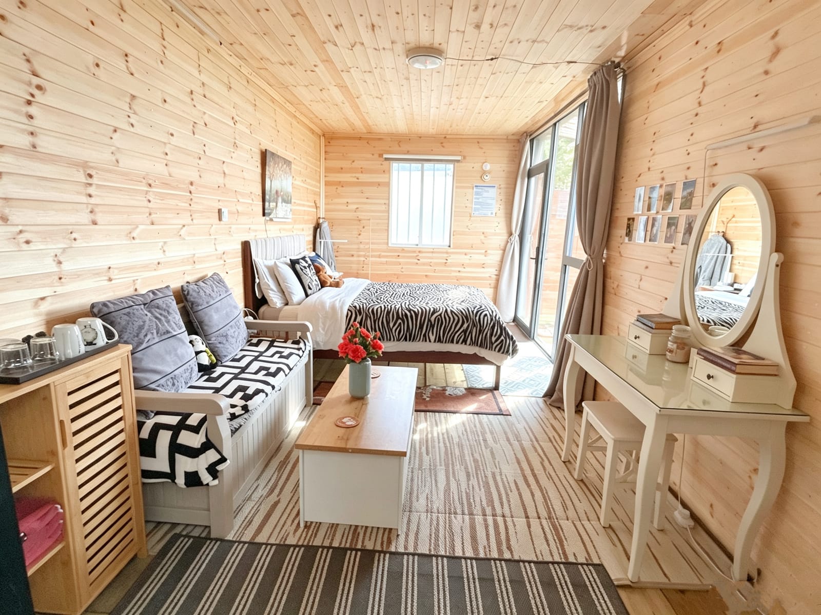 Full timber interior with bed and seating